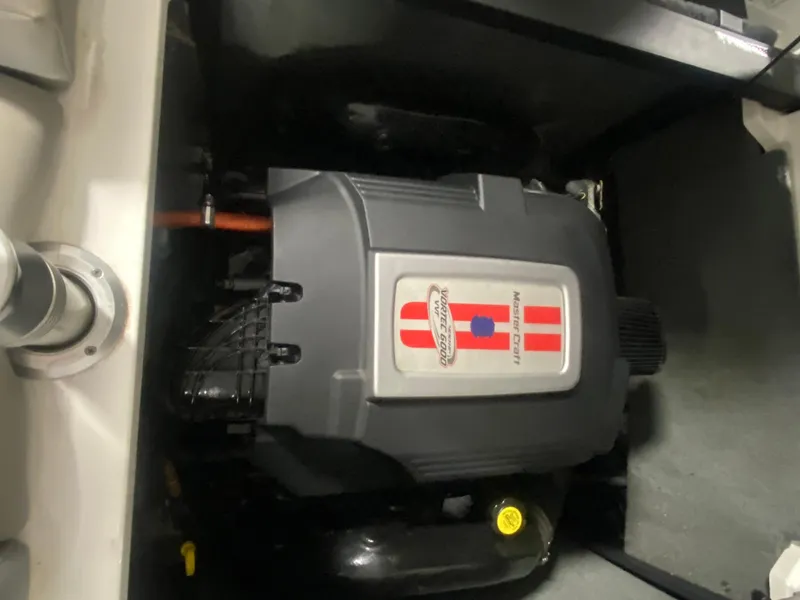 Slide: The Image of 2008 MasterCraft x 45 engine compartment with visible engine components. - 7