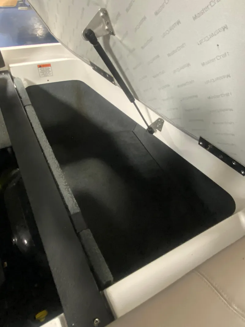 Slide: The Image of Open storage compartment in a 2008 MasterCraft X 45 boat. - 8