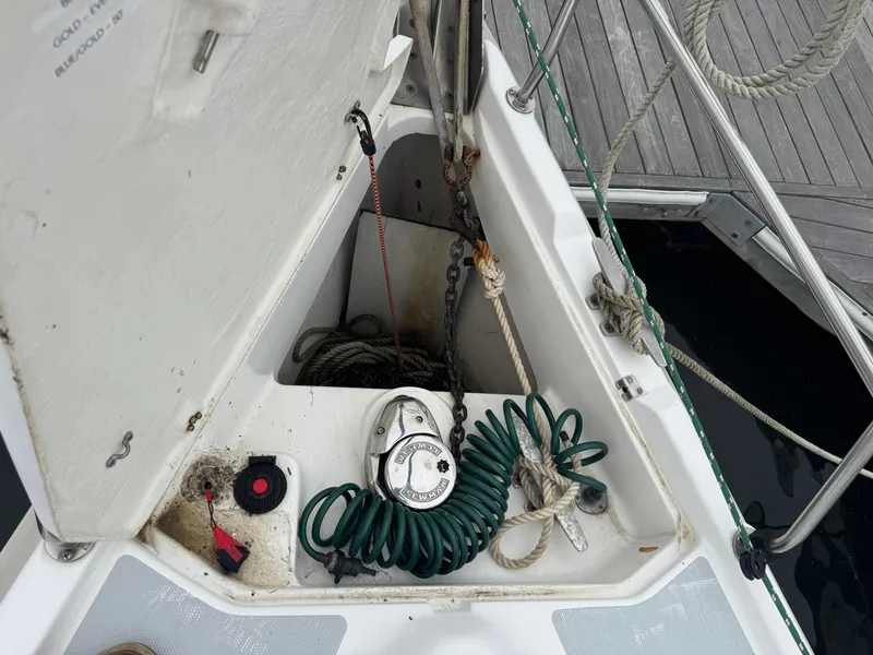 Slide: The Image of Anchor locker of 1998 Hunter 410 sailboat with ropes and equipment. - 18