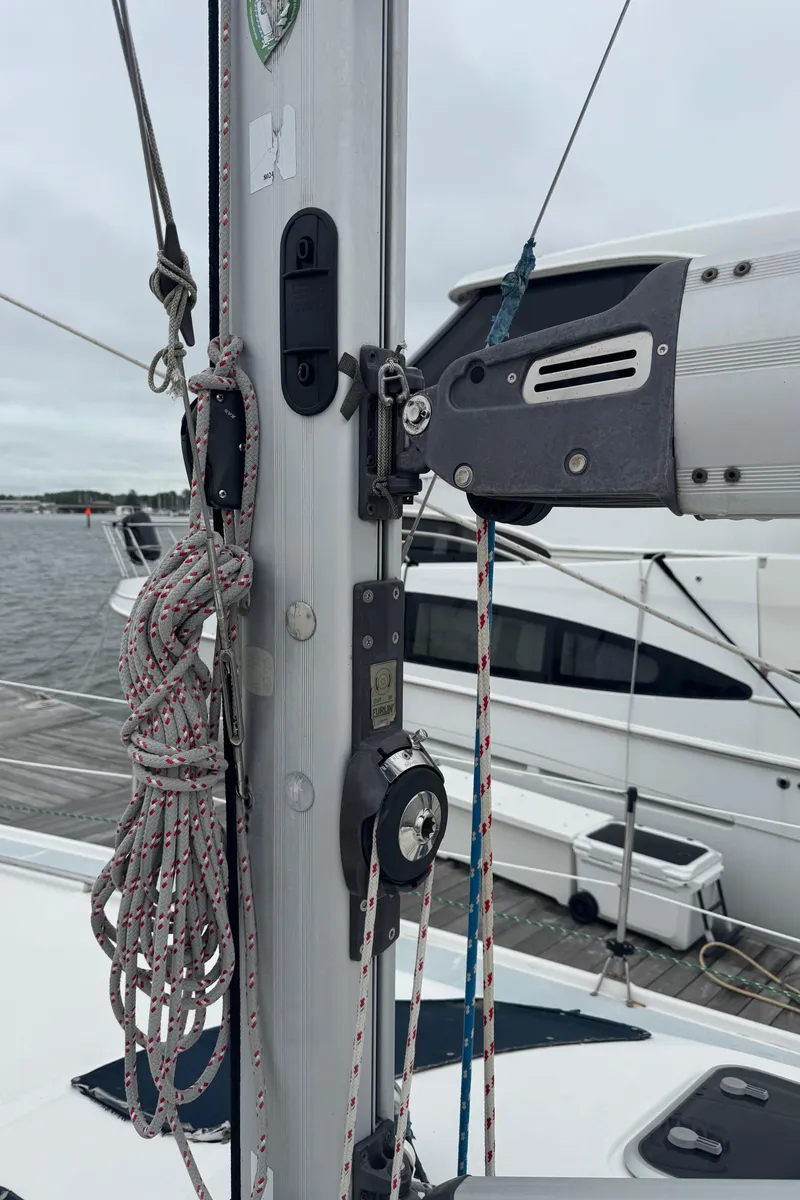 Slide: The Image of Sailboat mast and rigging on a 1998 Hunter 410, docked with other boats. - 24