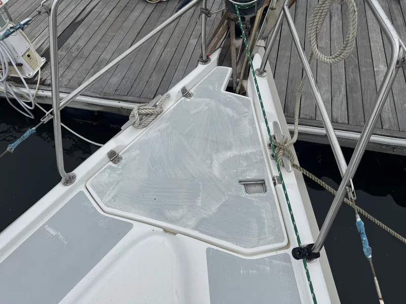 Slide: The Image of Deck of a 1998 Hunter 410 sailboat docked at a marina. - 27