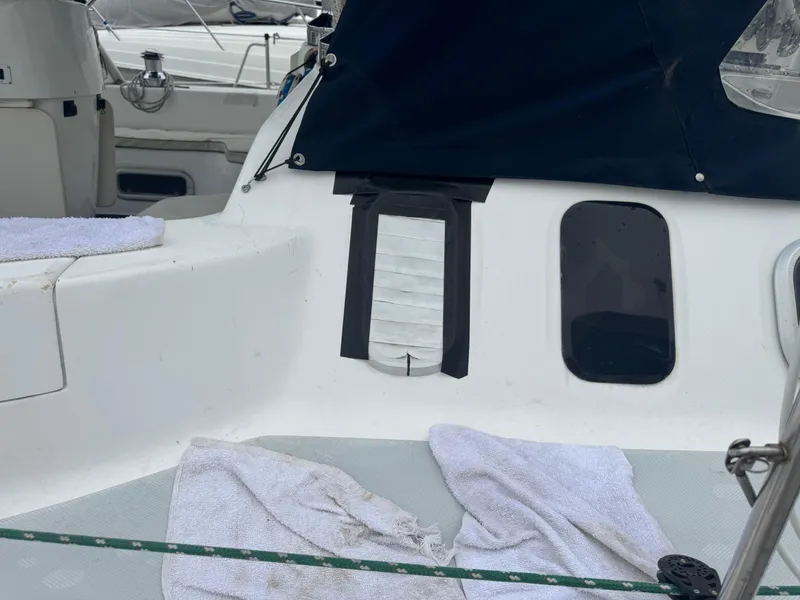 Slide: The Image of Hunter 410 sailboat cockpit, 1998 model, with towels and covered windows. - 33