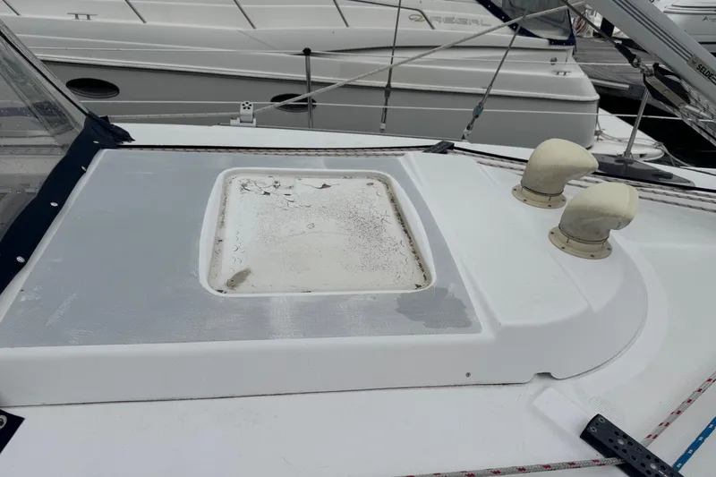 Slide: The Image of Deck of 1998 Hunter 410 sailboat with hatch and ventilation fittings. - 36