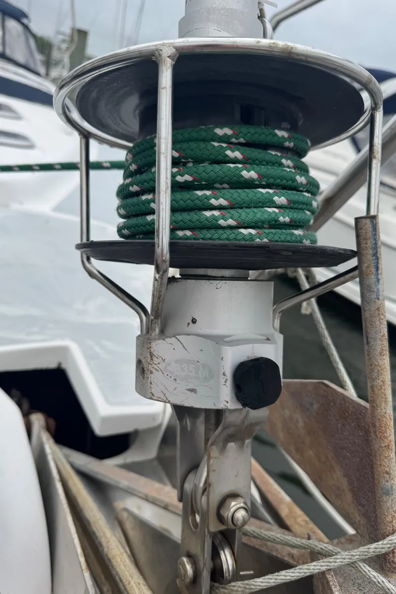 Slide: The Image of Close-up of a 1998 Hunter 410 sailboat's furling system with green rope. - 37