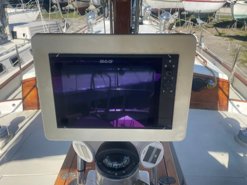 Slide: The Image of 1976 Cheoy Lee Clipper 42 yacht cockpit with navigation equipment and compass. - 16