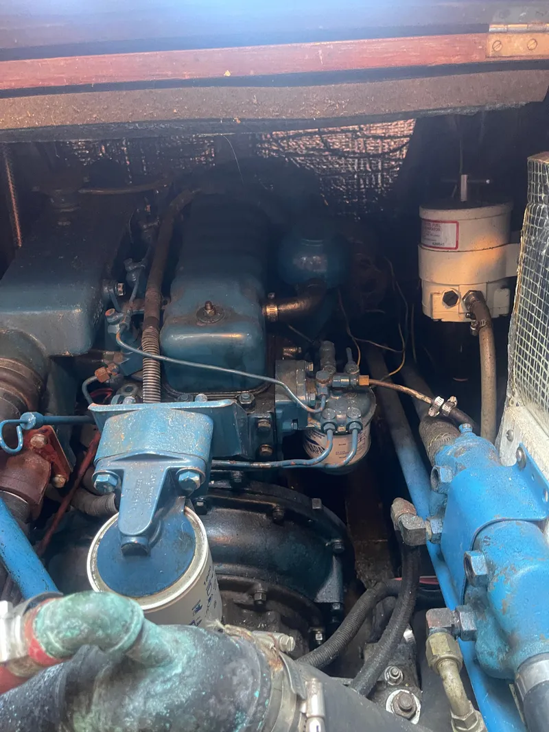 Slide: The Image of Engine compartment of a 1976 Cheoy Lee Clipper 42 boat, showcasing mechanical components. - 37