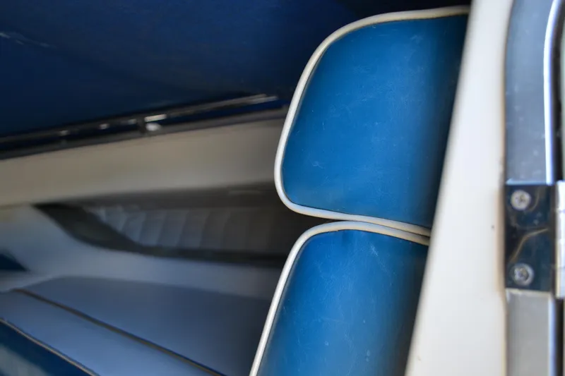 Slide: The Image of Close-up of blue and white interior seating on a 1997 Maxum 2300 SR boat. - 13
