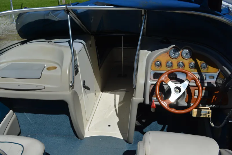 Slide: The Image of Interior of a 1997 Maxum 2300 SR boat with steering wheel and dashboard. - 6