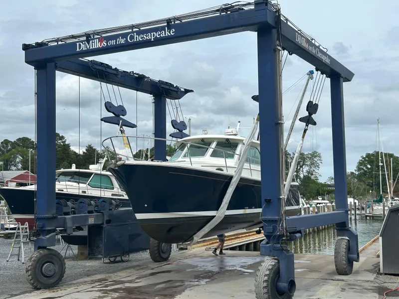 Slide: The Image of 2018 Back Cove 32 boat being lifted at DiMillo's on the Chesapeake marina. - 3