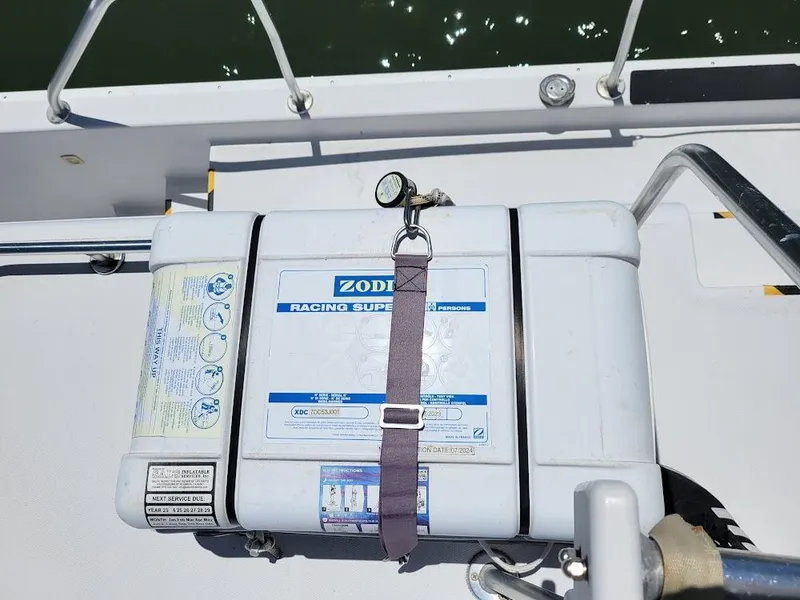 Slide: The Image of Zodiac Racing Super safety equipment on 1999 Mainship 430 Trawler deck. - 30