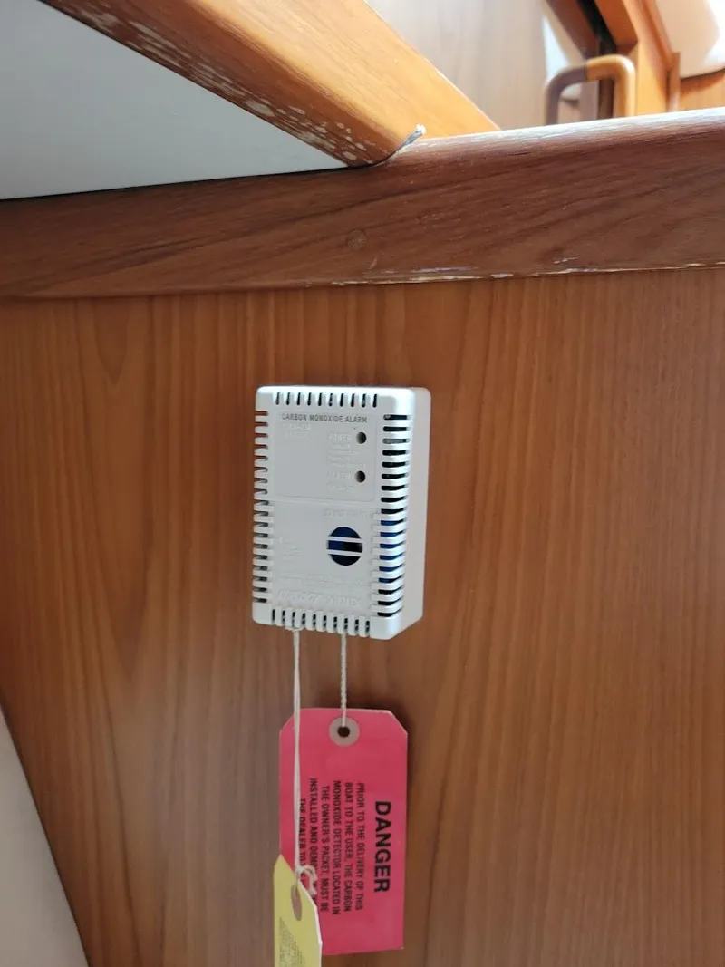 Slide: The Image of Carbon monoxide detector on 1999 Mainship 430 Trawler wooden interior. - 48