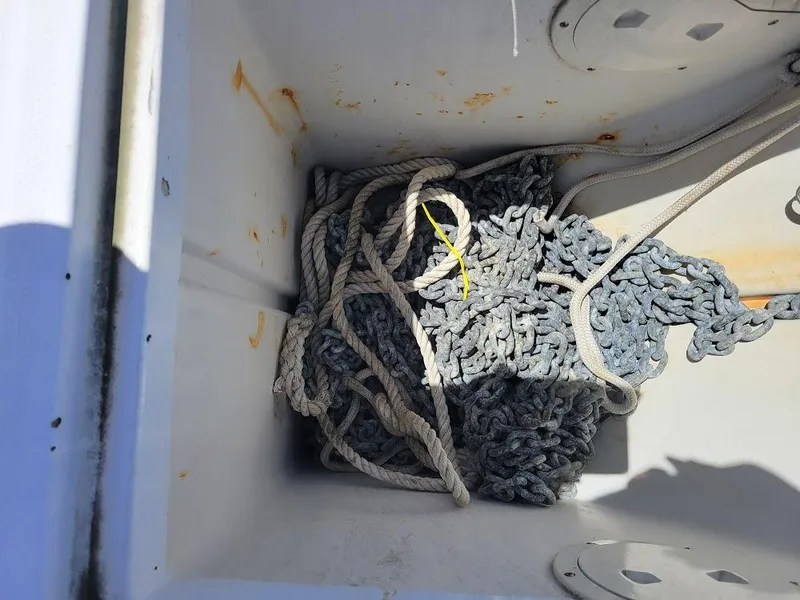 Slide: The Image of Anchor chain and rope storage on 1999 Mainship 430 Trawler boat. - 5