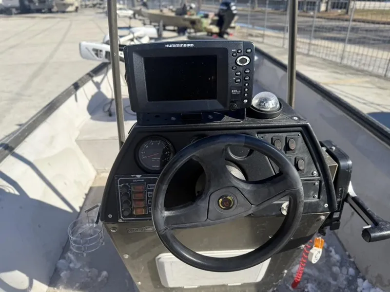 Slide: The Image of Steering console of a 2000 War Eagle 18 boat with Humminbird fish finder. - 6