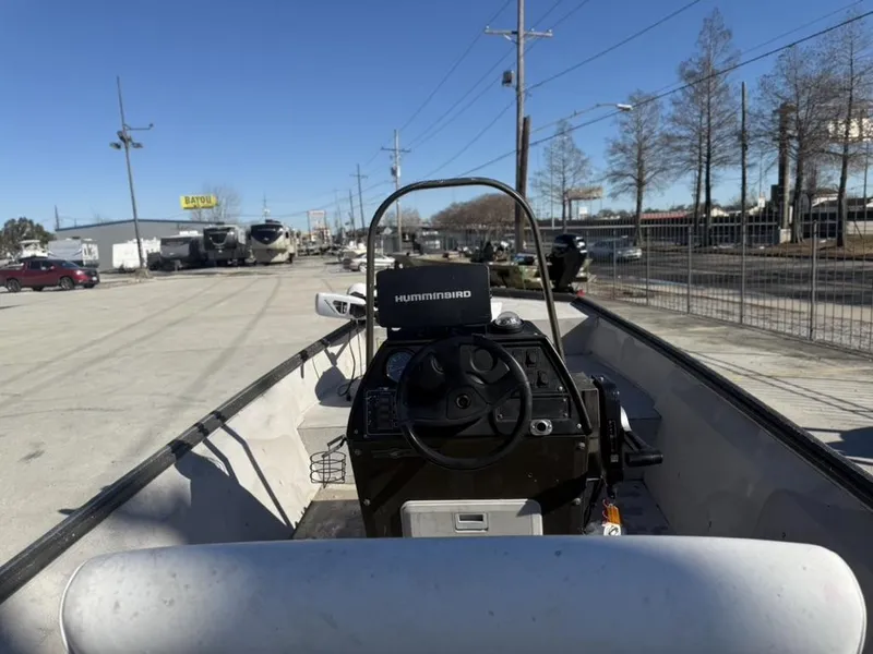 Slide: The Image of 2000 War Eagle 18 boat with Humminbird system, parked outdoors on a sunny day. - 7