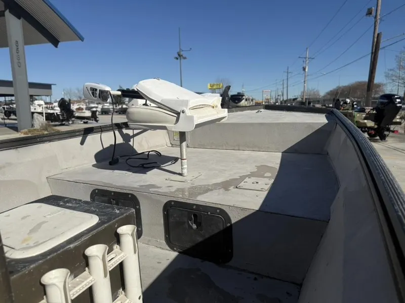 Slide: The Image of War Eagle 18 boat interior with trolling motor, 2000 model, parked outdoors. - 9