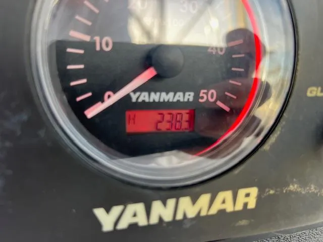 Slide: The Image of Yanmar engine gauge displaying 238.3 hours on a 2006 Hunter 44 Deck Salon. - 2