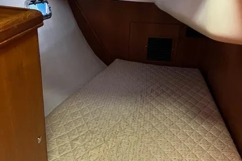 Slide: The Image of Interior cabin of 2006 Hunter 44 Deck Salon with quilted bed. - 26