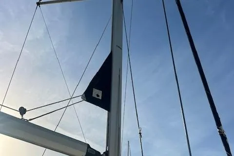 Slide: The Image of Sailboat mast and rigging of 2006 Hunter 44 Deck Salon against blue sky. - 8