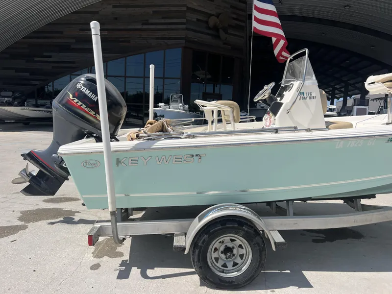 Slide: The Image of 2018 Key West 176 Island Bay boat on trailer with Yamaha outboard motor. - 2