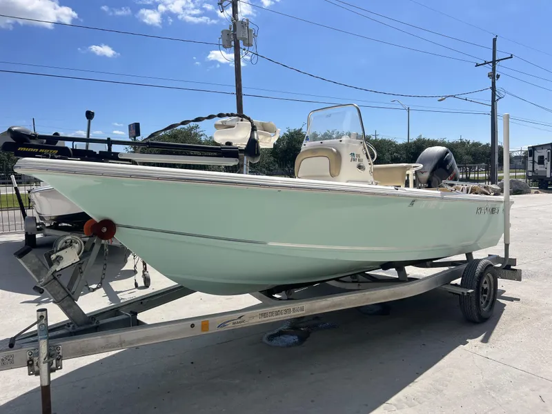 Slide: The Image of 2018 Key West 176 Island Bay boat on trailer under clear blue sky. - 4