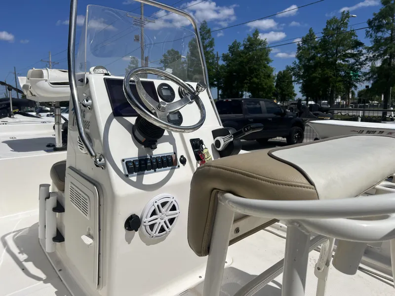 Slide: The Image of 2018 Key West 176 Island Bay boat console with steering wheel and controls. - 6