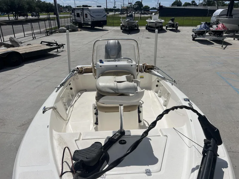 Slide: The Image of 2018 Key West 176 Island Bay boat in a parking lot, surrounded by trailers and other boats. - 9