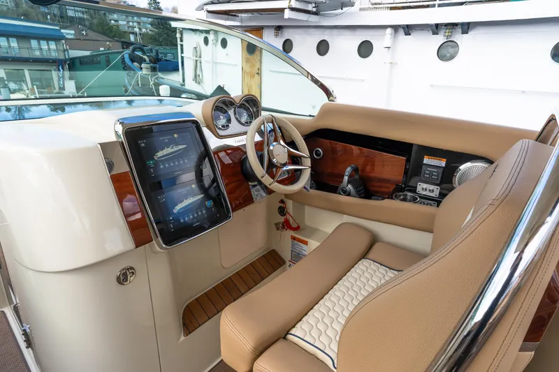 Slide: The Image of 2025 Chris-Craft Launch 35 GT cockpit with modern controls and luxurious seating. - 16