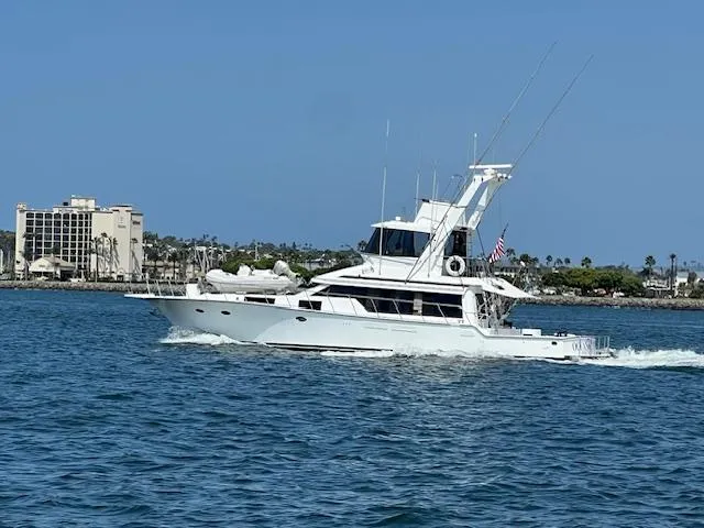 The Image of Mikelson 64 yacht from 1994 cruising on a sunny day near the coastline. - 2