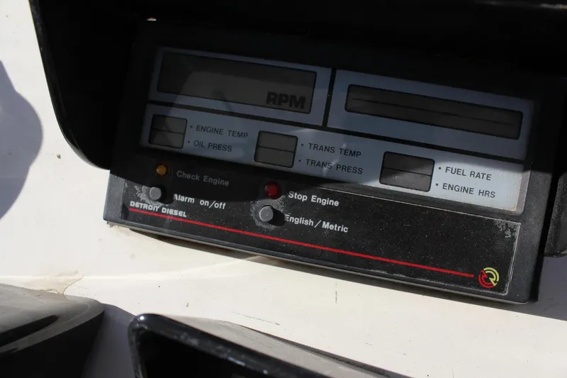 Slide: The Image of Control panel of a 1994 Mikelson 64 yacht with engine indicators and RPM display. - 25