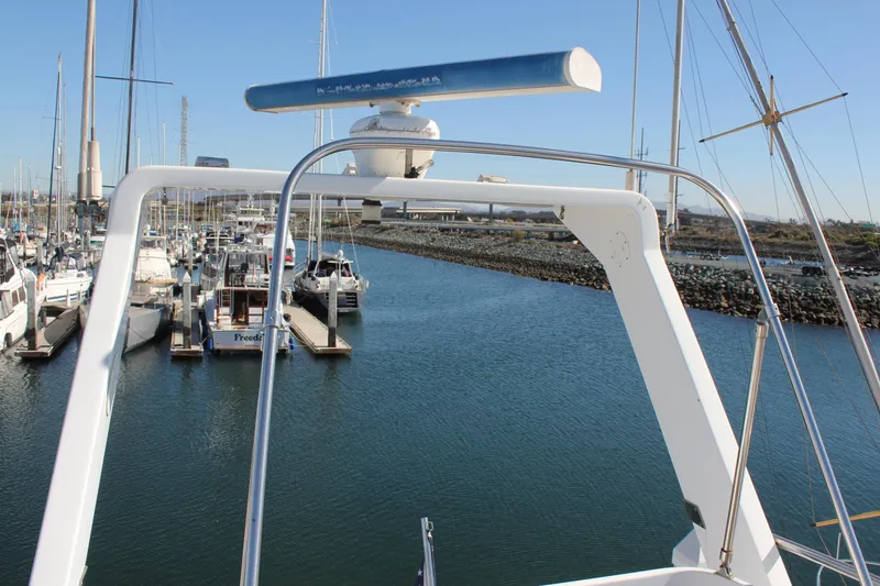Slide: The Image of View from Mikelson 64 yacht, 1994 model, overlooking marina with docked boats. - 27