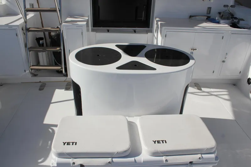 Slide: The Image of Mikelson 64 yacht deck with Yeti coolers and storage, 1994 model. - 6