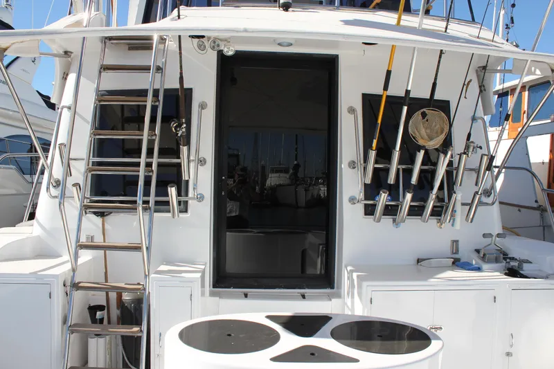 Slide: The Image of 1994 Mikelson 64 yacht stern with fishing rods and ladder. - 7