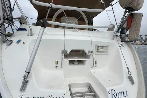 Slide: The Image of Bavaria 42 Cruiser 2000 yacht stern view with ladder and cockpit details. - 12