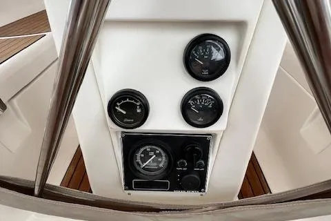 Slide: The Image of Control panel of a 2000 Bavaria 42 Cruiser sailboat with gauges and dials. - 15