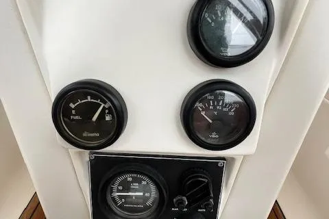 Slide: The Image of Instrument panel of a 2000 Bavaria 42 Cruiser sailboat, featuring fuel and speed gauges. - 16