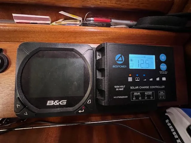Slide: The Image of Bavaria 42 Cruiser 2000: B&G display and ACOPower solar charge controller showing 12.5 volts. - 22