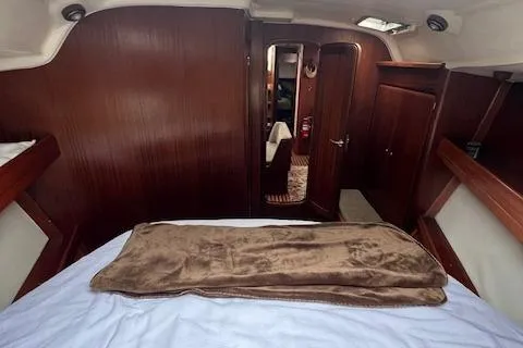 Slide: The Image of Interior cabin of a 2000 Bavaria 42 Cruiser yacht with wooden finishes. - 37