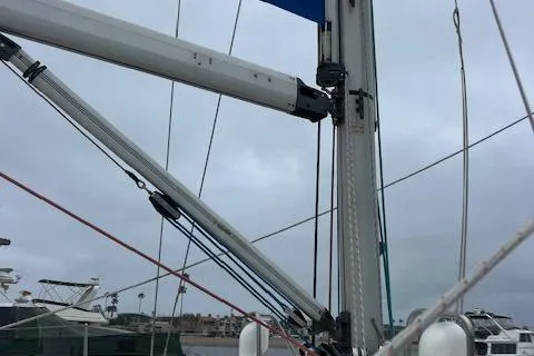 Slide: The Image of Bavaria 42 Cruiser 2000 sailboat mast and rigging against cloudy sky. - 45