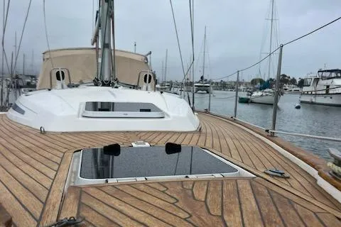 Slide: The Image of Bavaria 42 Cruiser 2000 sailboat with wooden deck in marina setting. - 7
