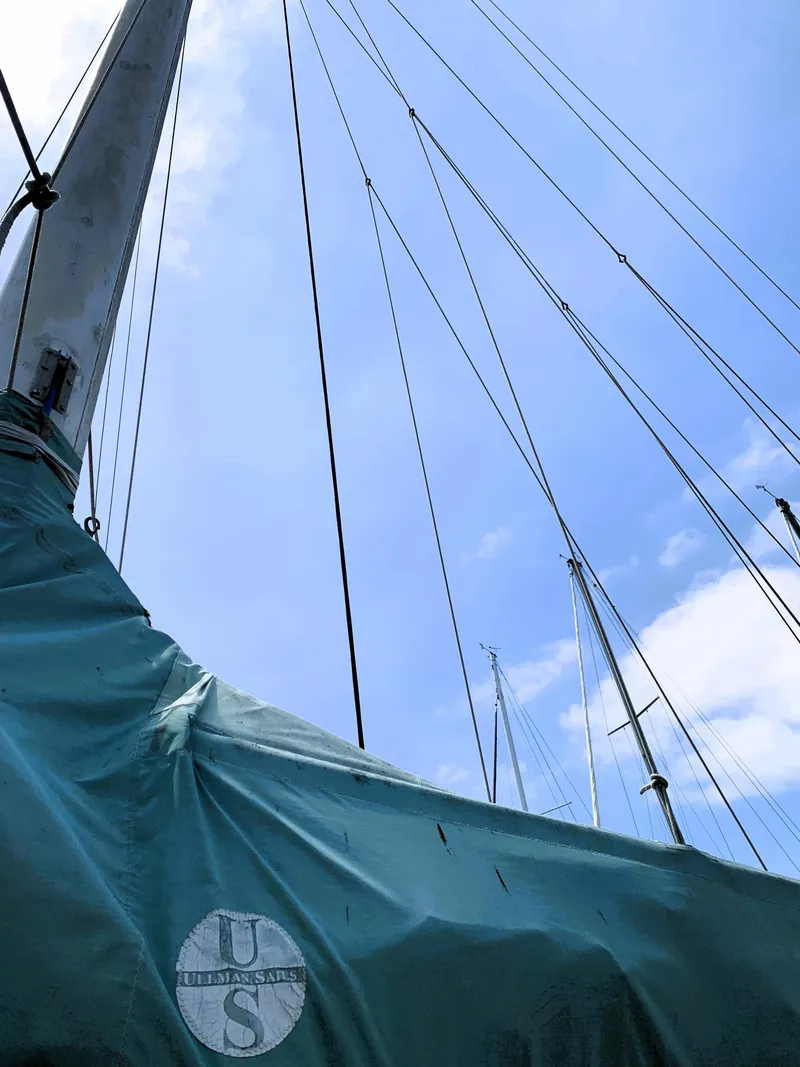 Slide: The Image of Sailboat mast and rigging of 1979 Robert Perry 41 Sloop against blue sky. - 14