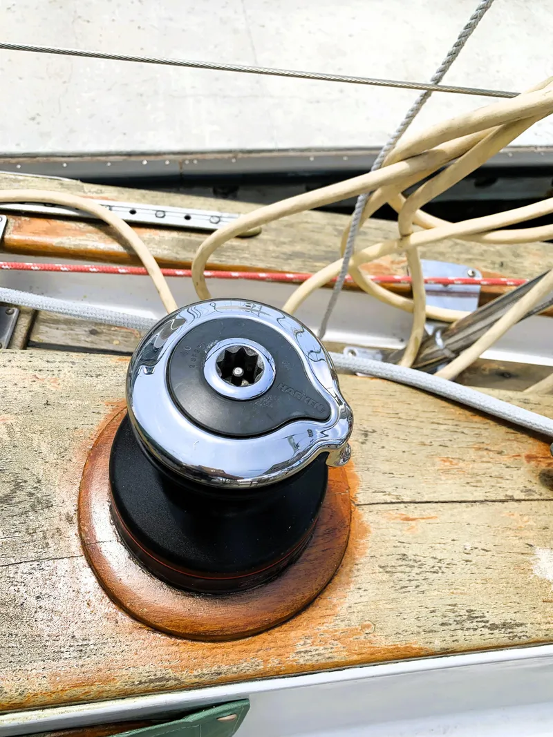 Slide: The Image of Winch on 1979 Robert Perry 41 Sloop with ropes and wooden deck. - 21