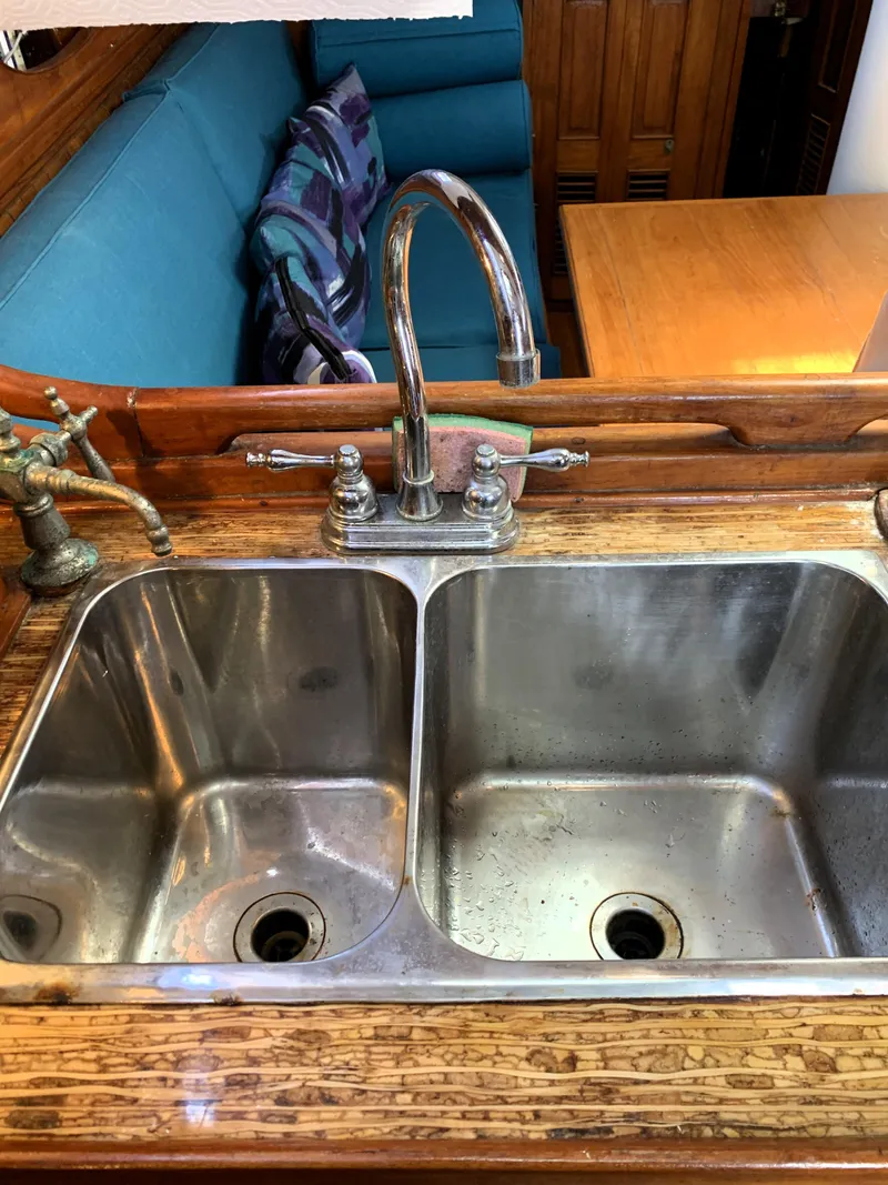 Slide: The Image of Stainless steel double sink on 1979 Robert Perry 41 Sloop yacht interior. - 38