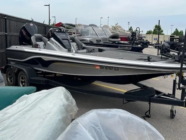 Slide: The Image of 2022 Nitro Z19 boat on trailer in outdoor storage area. - 1