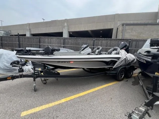 Slide: The Image of 2022 Nitro Z19 boat on trailer in parking lot. - 2