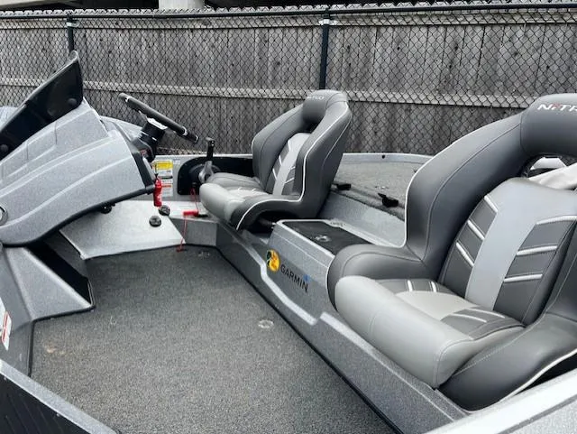 Slide: The Image of 2022 Nitro Z19 boat interior with gray seating and steering console. - 5