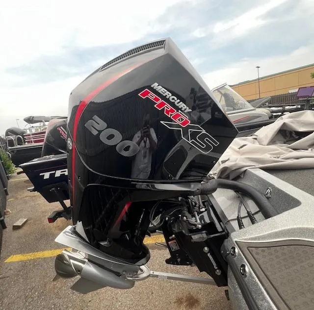 Slide: The Image of 2022 Nitro Z19 with Mercury Pro XS 200 engine, parked outdoors. - 9