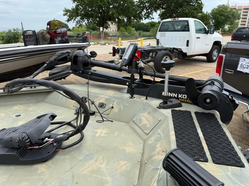 Slide: The Image of 2017 Tracker Grizzly 1654 MVX Sportsman boat with Minn Kota trolling motor in parking lot. - 19