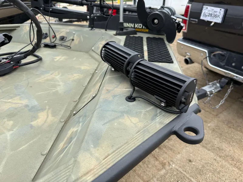 Slide: The Image of 2017 Tracker Grizzly 1654 MVX Sportsman boat with mounted LED lights and trolling motor. - 20