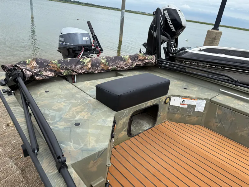 Slide: The Image of 2017 Tracker Grizzly 1654 MVX Sportsman boat with camo design and Mercury outboard motor. - 23