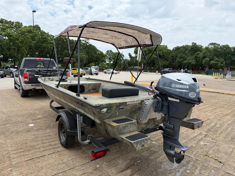 Slide: The Image of 2017 Tracker Grizzly 1654 MVX Sportsman boat with Yamaha motor on trailer. - 30